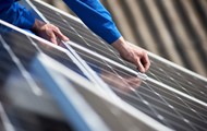 A Man Working with Solar Panel