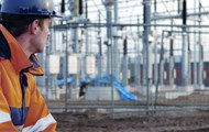 A Man Staring at a Power Plant