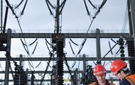 Two men working on a power plant