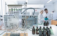 Man and a woman checking a bottle